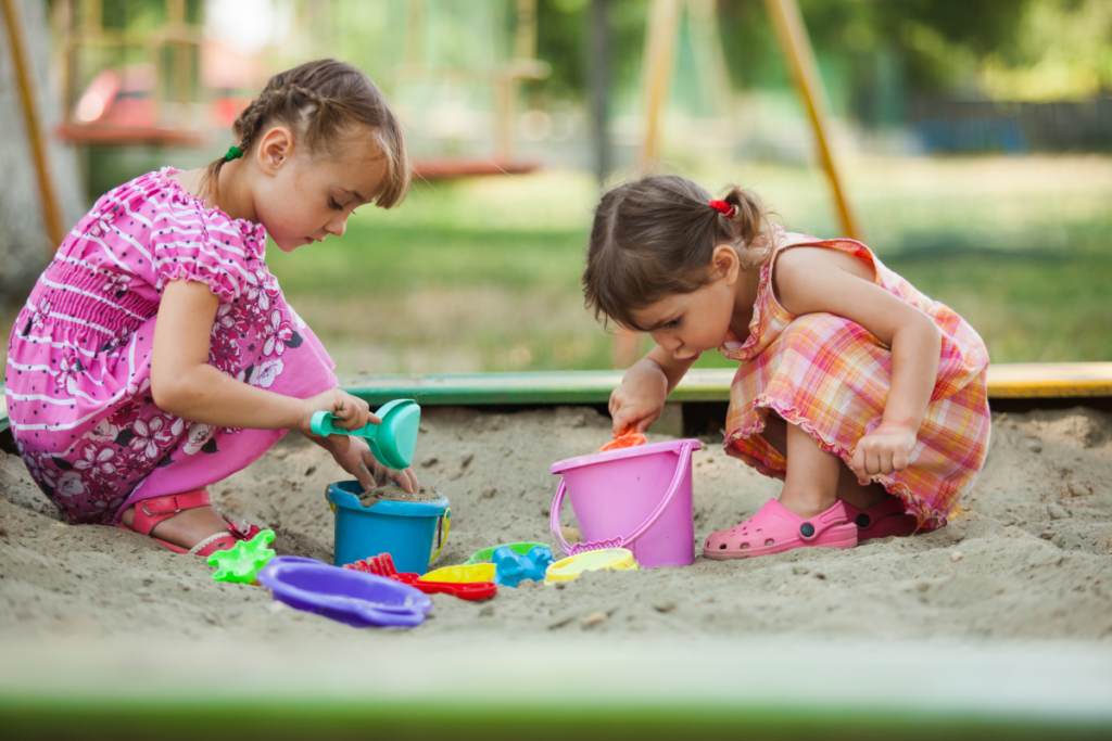 Sandbox with girls Sandbox with two girls playing