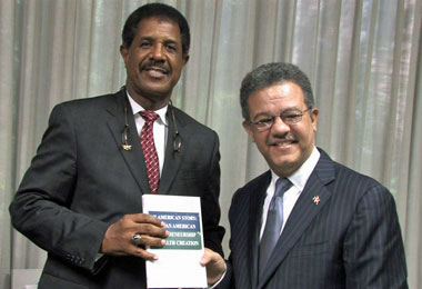 Dominican President Dr. Leonel Fernández Reyna with John Sibley Butler