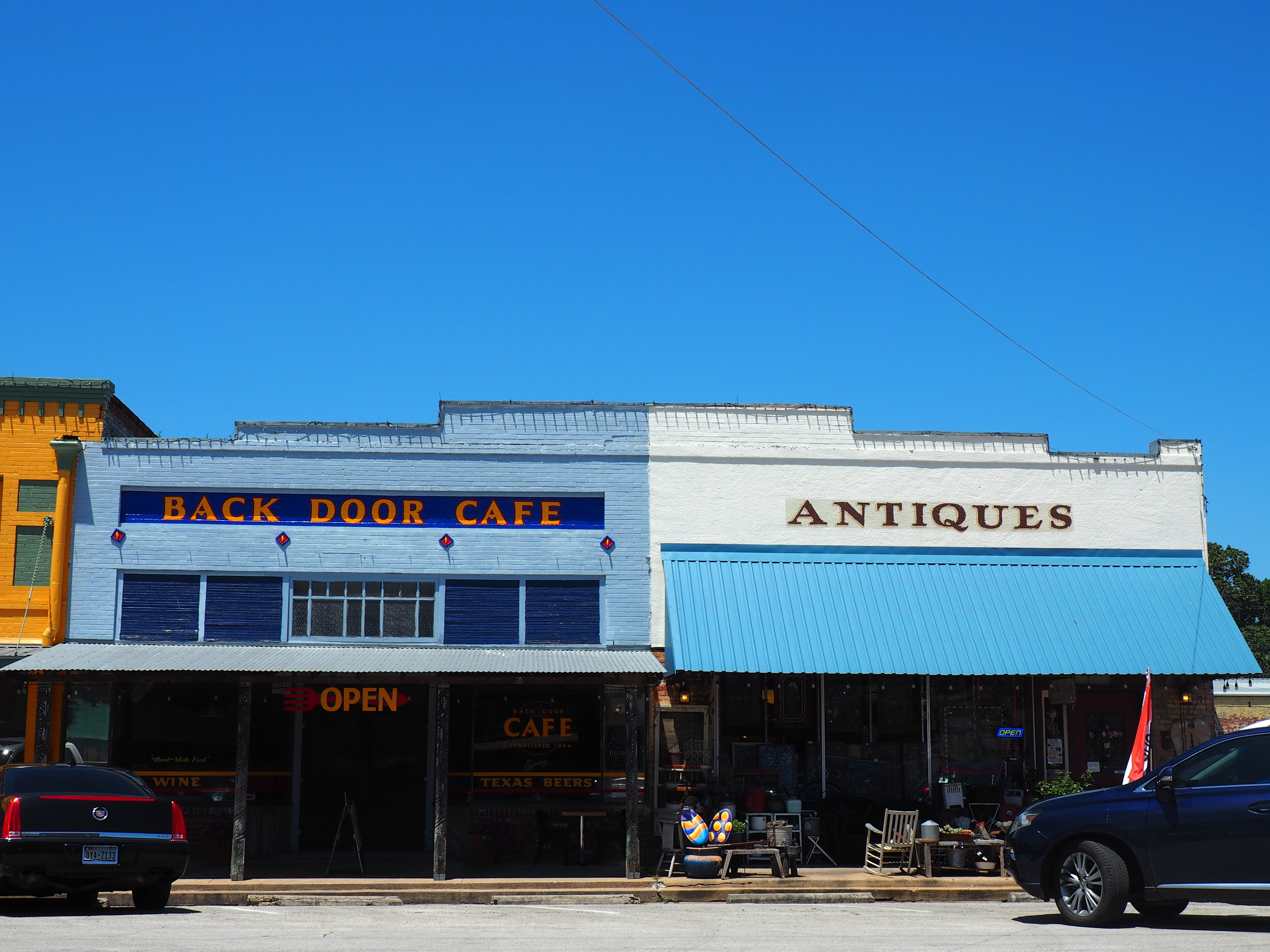 small town cafe and antique store with blue sky background