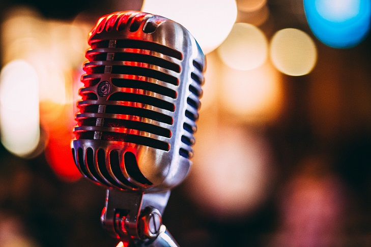 Microphone with blurry lights in the background.