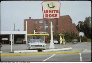 gas station sign that says "white rose"