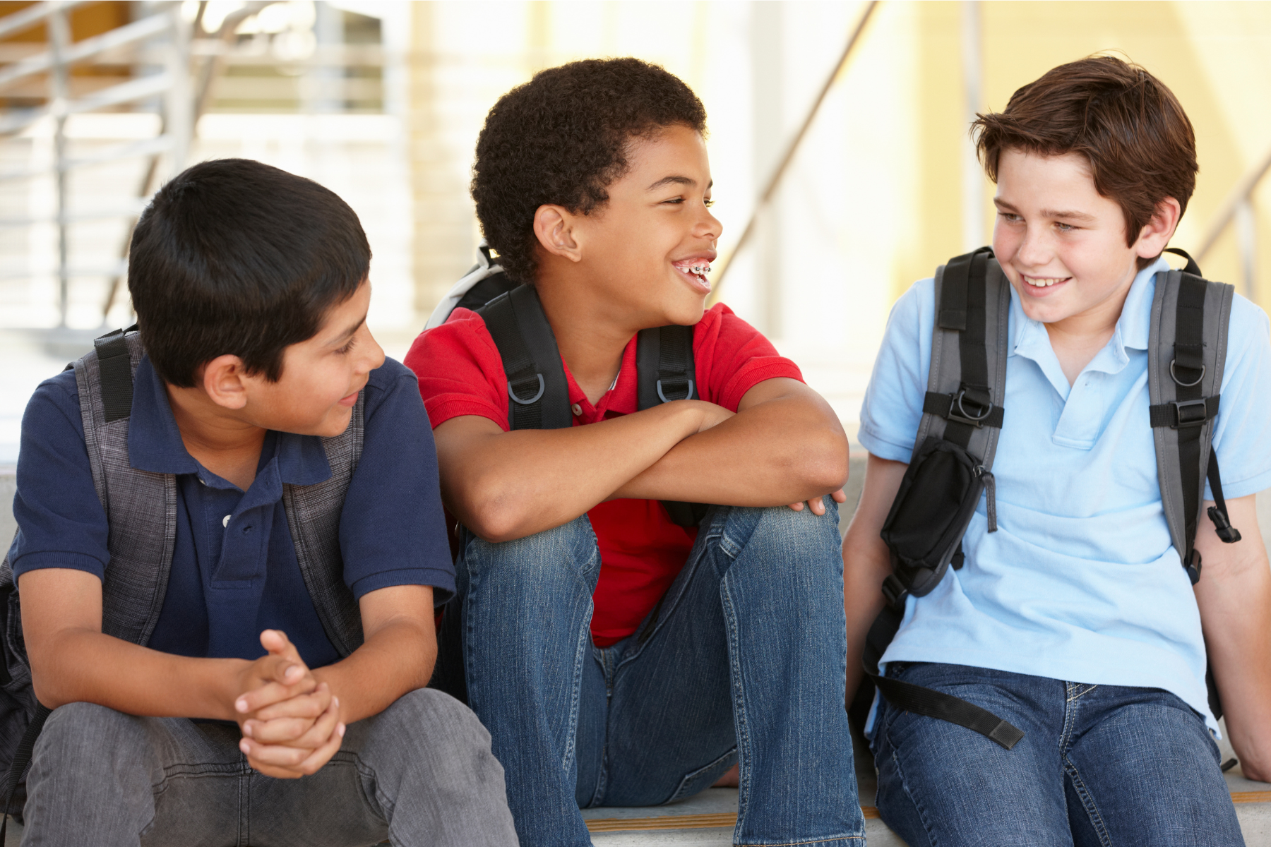 Adolescent boys with backpacks