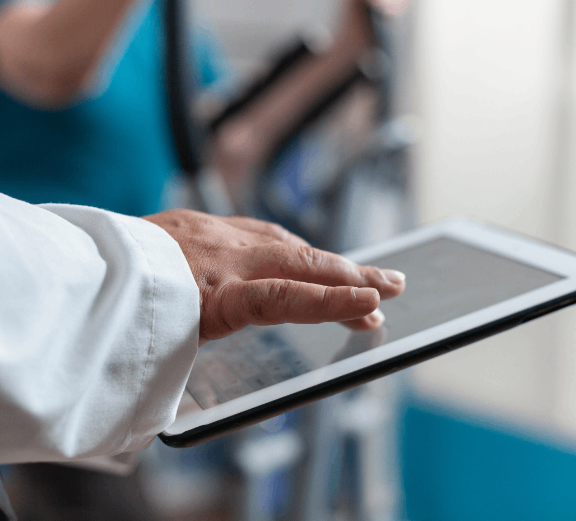 close up doctor using digital tablet with touch screen (1) (1)