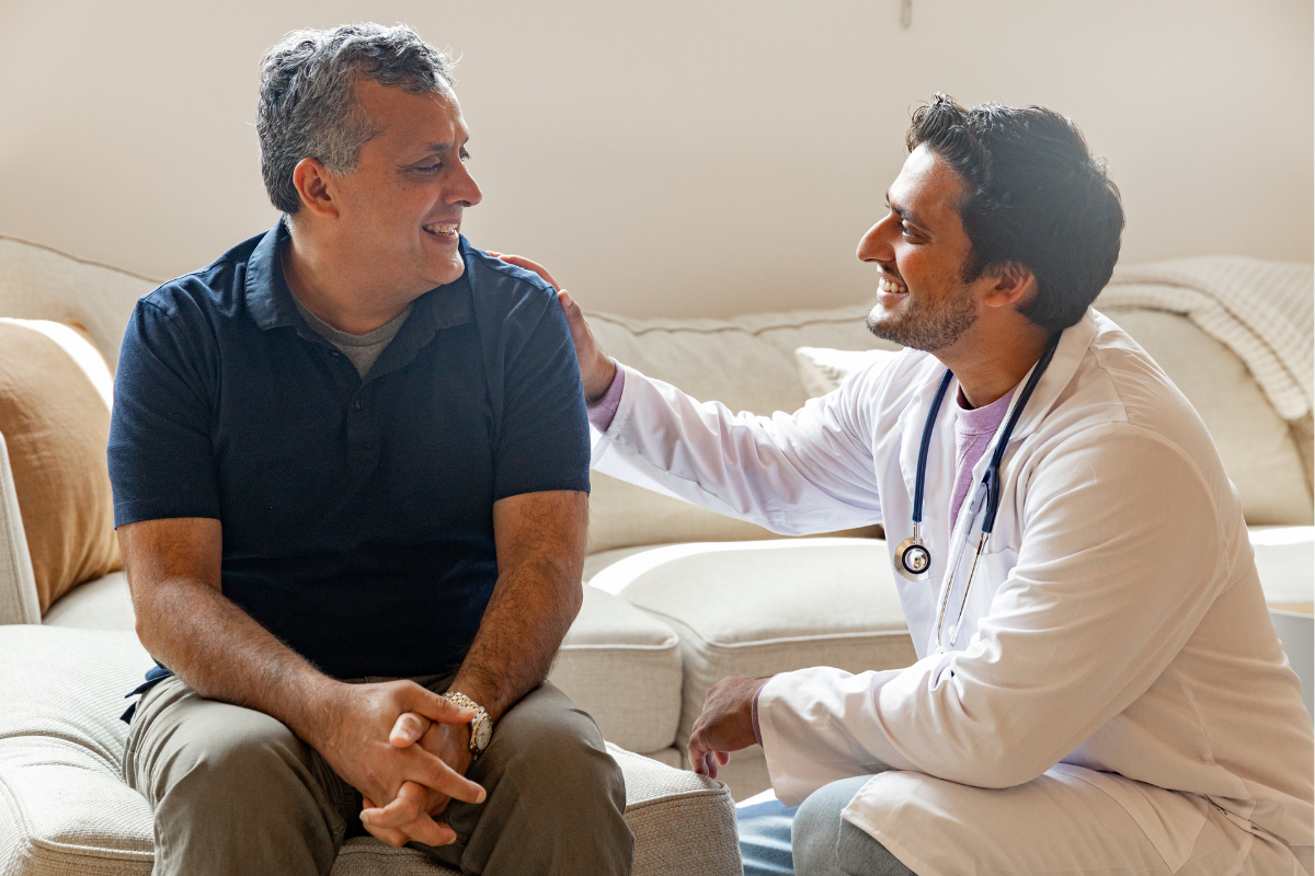 Doctor comforts patient, displaying human agency