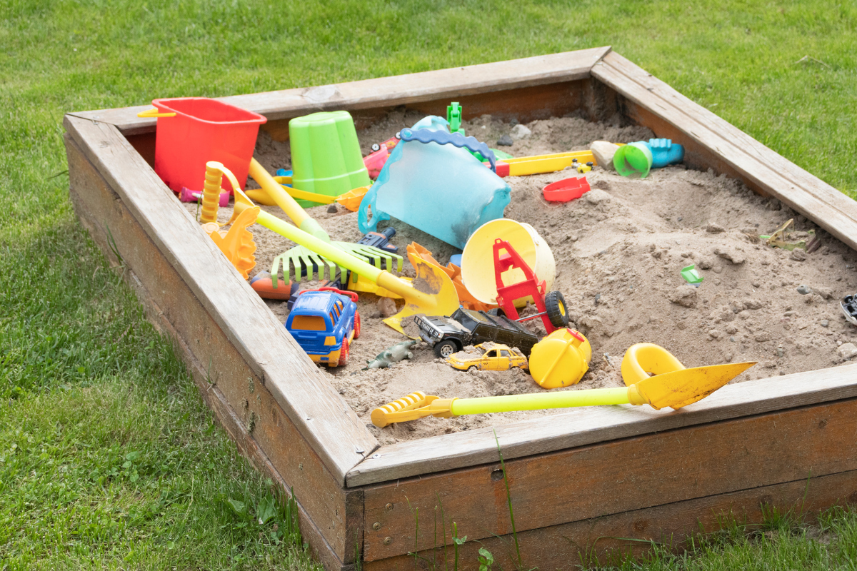 Sandbox filled with toys